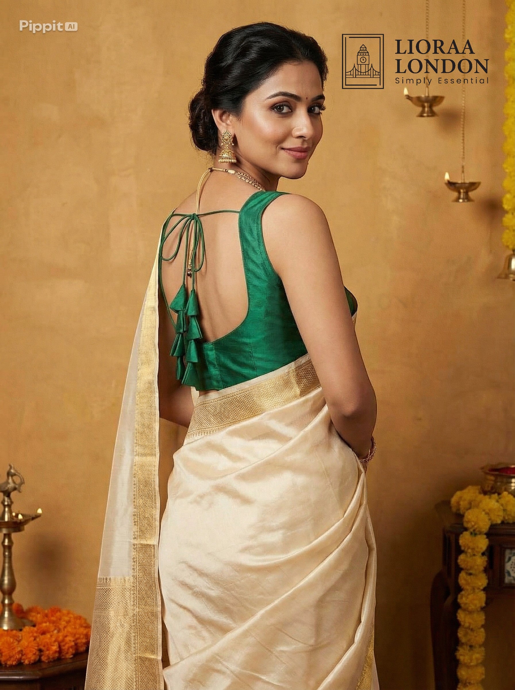 Lioraa London Ltd cream silk saree with gold border and emerald green sleeveless blouse with back tie-up tassels